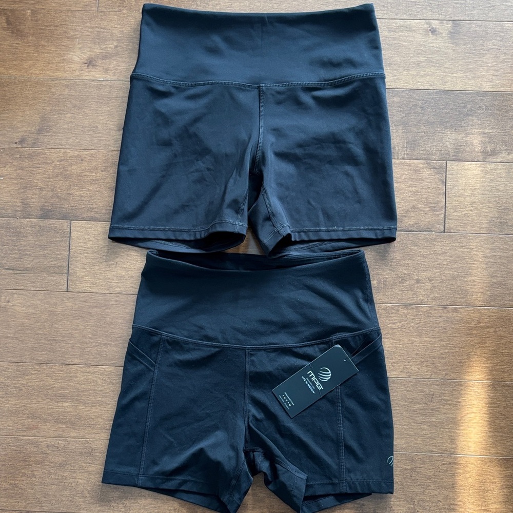 TWO pairs of black high waisted athletic shorts
